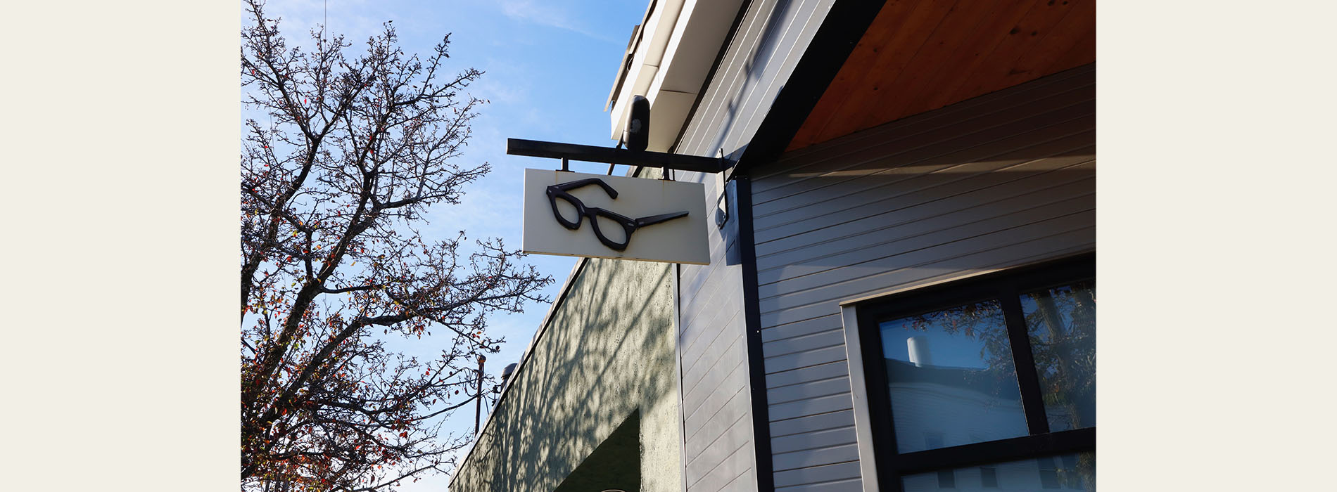 The image shows a building with a sign that reads Six on the side, set against a clear sky.